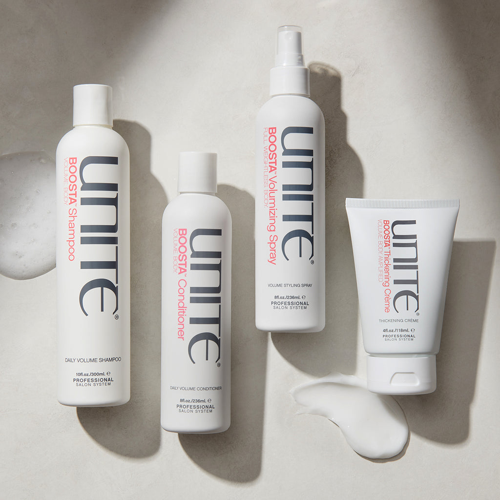 UNITE Hair’s BOOSTA Volumizing Spray alongside BOOSTA Shampoo, Conditioner, and Thickening Crème.